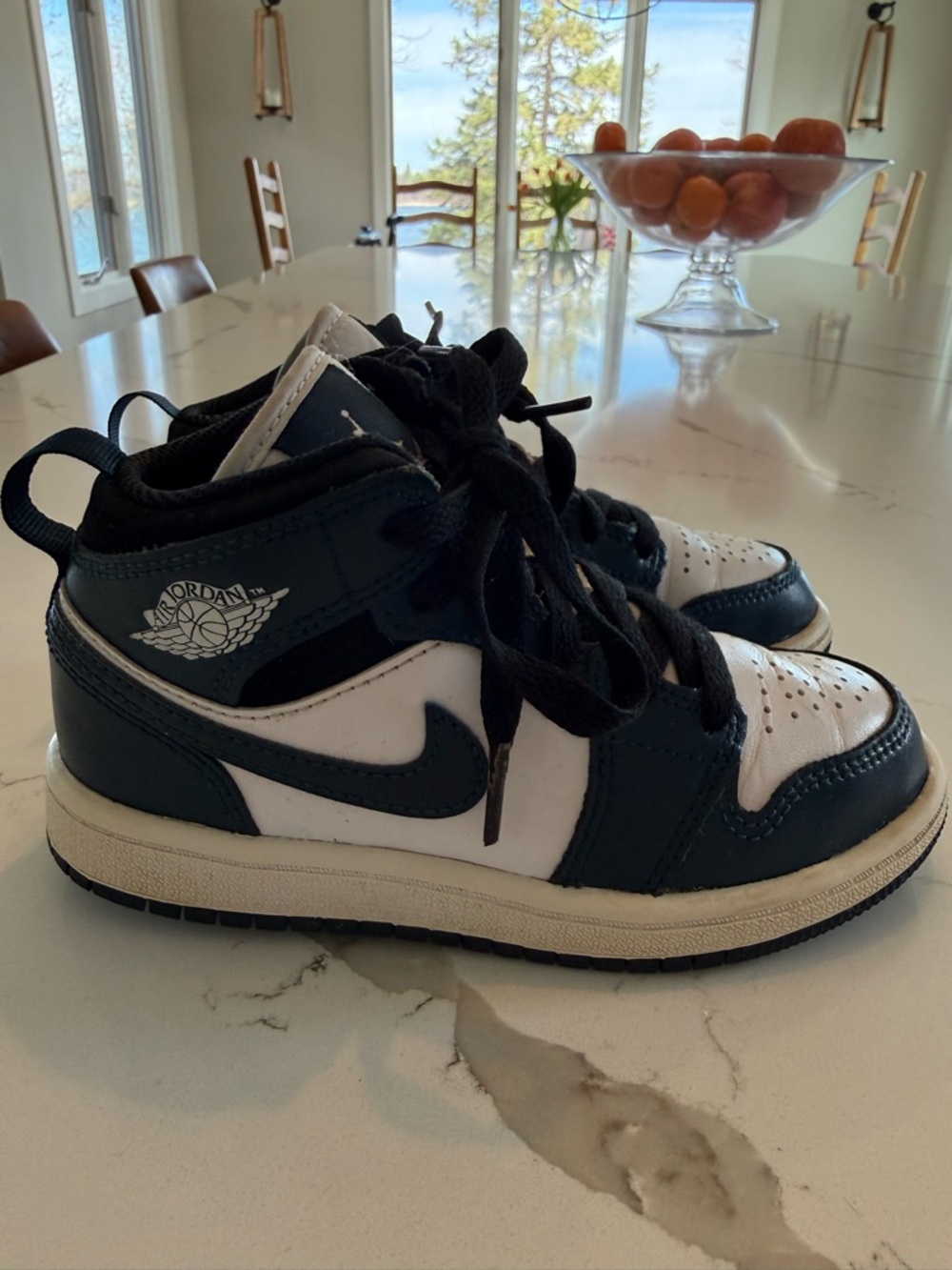 Jordan Kids' Black and White High-Top Sneakers. Used but in good condition